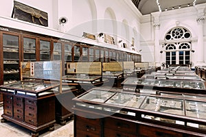 Antique and historical objects place and exhibit inside cabinet in The Indian Museum at Kolkata, India