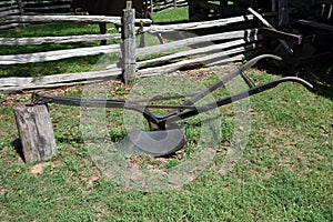 An antique horse-drawn plow from pioneer days