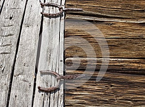 Antique horseshoes as barn door hinges