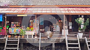 Antique house shop along the canal at Ampawa