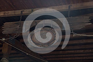 Antique Insignia with Copyspace Hanged at Wooden Rooftop with Brown Plank