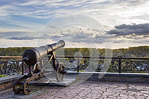 Antique iron cannon and amazing cloudy evening sky