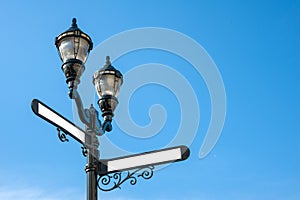 Antique iron streetlight with blank street names