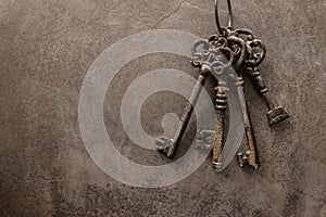 Antique keys on old steel metal texture background