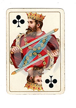 An antique king of clubs playing card.