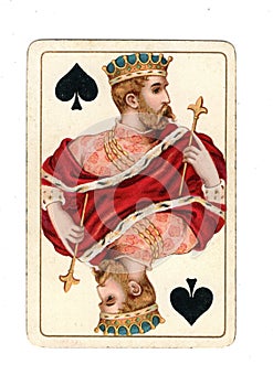 An antique king of spades playing card.