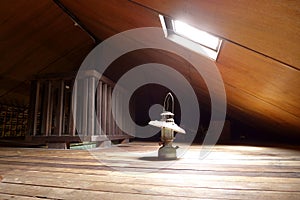 Antique lamp in old attic with skylight