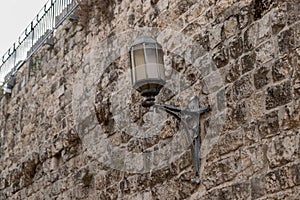 The antique lamp on the wall in Armenian Patriarchate Street passing through the Armenian quarter in the old city of Jerusalem,