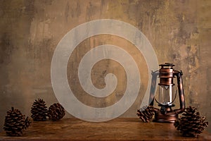 Antique lantern background with pine cones