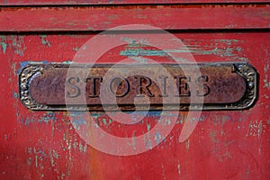 Antique letter slot relabeled as stories photo