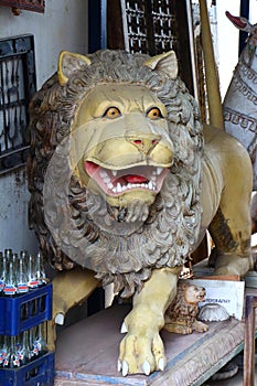 Antique lion. The wooden statue. India
