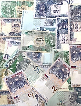 Antique Malaysian ringgit banknotes background.