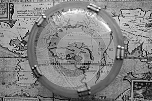 Antique map through nautical magnifying glass photo