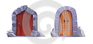 Antique medieval wooden door with metal round handle and lined with stones. Gothic entrance, gate in a castle, church or