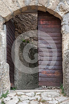 Antique metal door in Chufut-Kale in Crimean Mountains, medieval  city-fortress,  national monument of  Karaites, now in ruins Chu