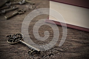 Antique Metal House Keys and Old Book