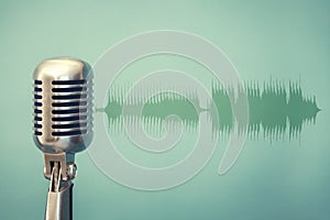 antique microphone on green background and audio waveform