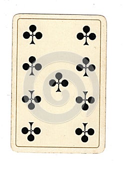 An antique nine of clubs playing card.