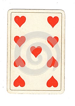 An antique nine of hearts playing card.