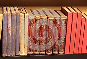 Antique - old shabby books on bookshelf