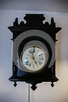 Antique old vintage clock on white wall