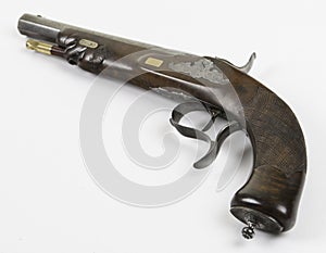 An antique percussion pistol