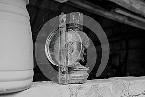 Antique petroleum lamp in an old barn.High quality photo.