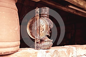 Antique petroleum lamp in an old barn.High quality photo.