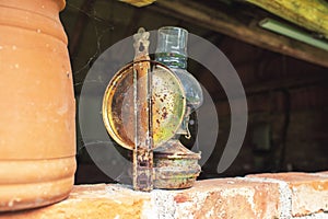 Antique petroleum lamp in an old barn.High quality photo.