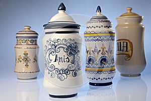 Antique pharmacy jars of artisanal ceramics, medicinal herbs photo