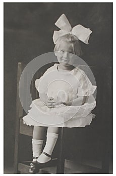 Antique photograph girl with big bow