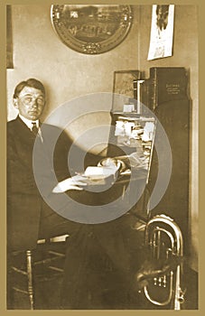 Antique photograph of man at desk