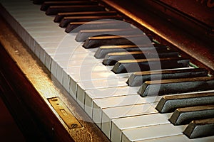 Antique piano keyboard from ebony and ivory, warm color toned