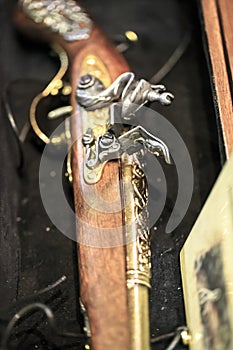 Antique pirate gun on a box