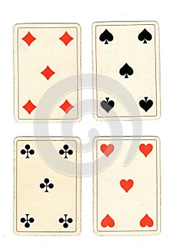 Antique playing cards showing four fives.