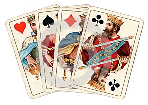 Antique playing cards showing four kings.