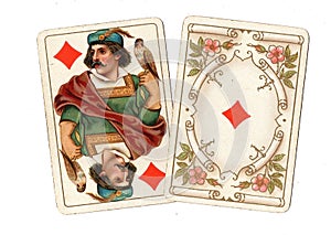 Antique playing cards showing a jack and ace of diamonds.