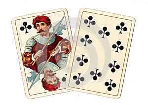 Antique playing cards showing a jack and ten of clubs.