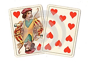 Antique playing cards showing a jack and ten of hearts.