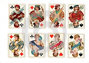 Antique playing cards showing jacks and queens in all four suits.