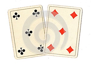 Antique playing cards showing a pair of fives.