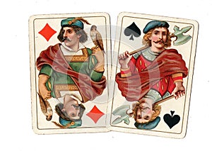 Antique playing cards showing a pair of jacks.