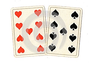 Antique playing cards showing a pair of nines. photo