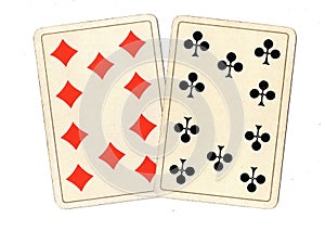 Antique playing cards showing a pair of tens.