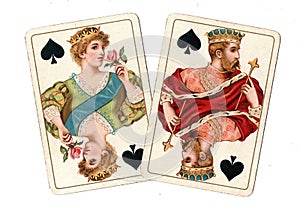 Antique playing cards showing a queen and king of spades.