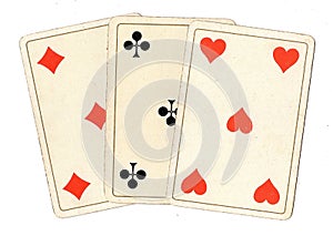 Antique playing cards showing three fives.