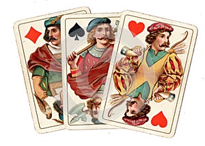 Antique playing cards showing three jcks.