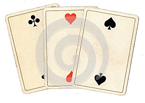 Antique playing cards showing three twos.
