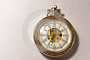 Antique pocket watch with visible mechanism