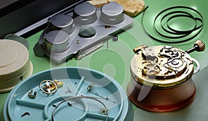 Antique pocket watch in the watchmaker`s workshop